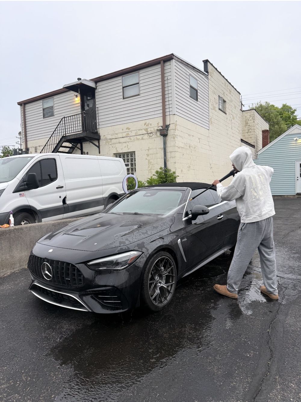 Black Mercedes-AMG convertible being hand washed