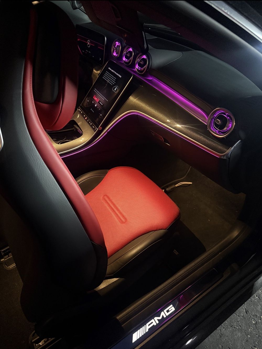 Mercedes-AMG red and black interior with ambient lighting after detailing
