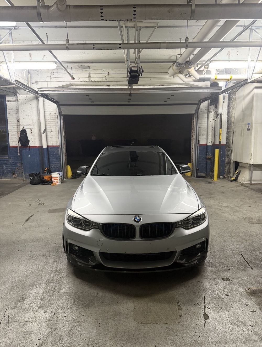 Head-on view of the detailed silver BMW 4 Series showing a glossy hood