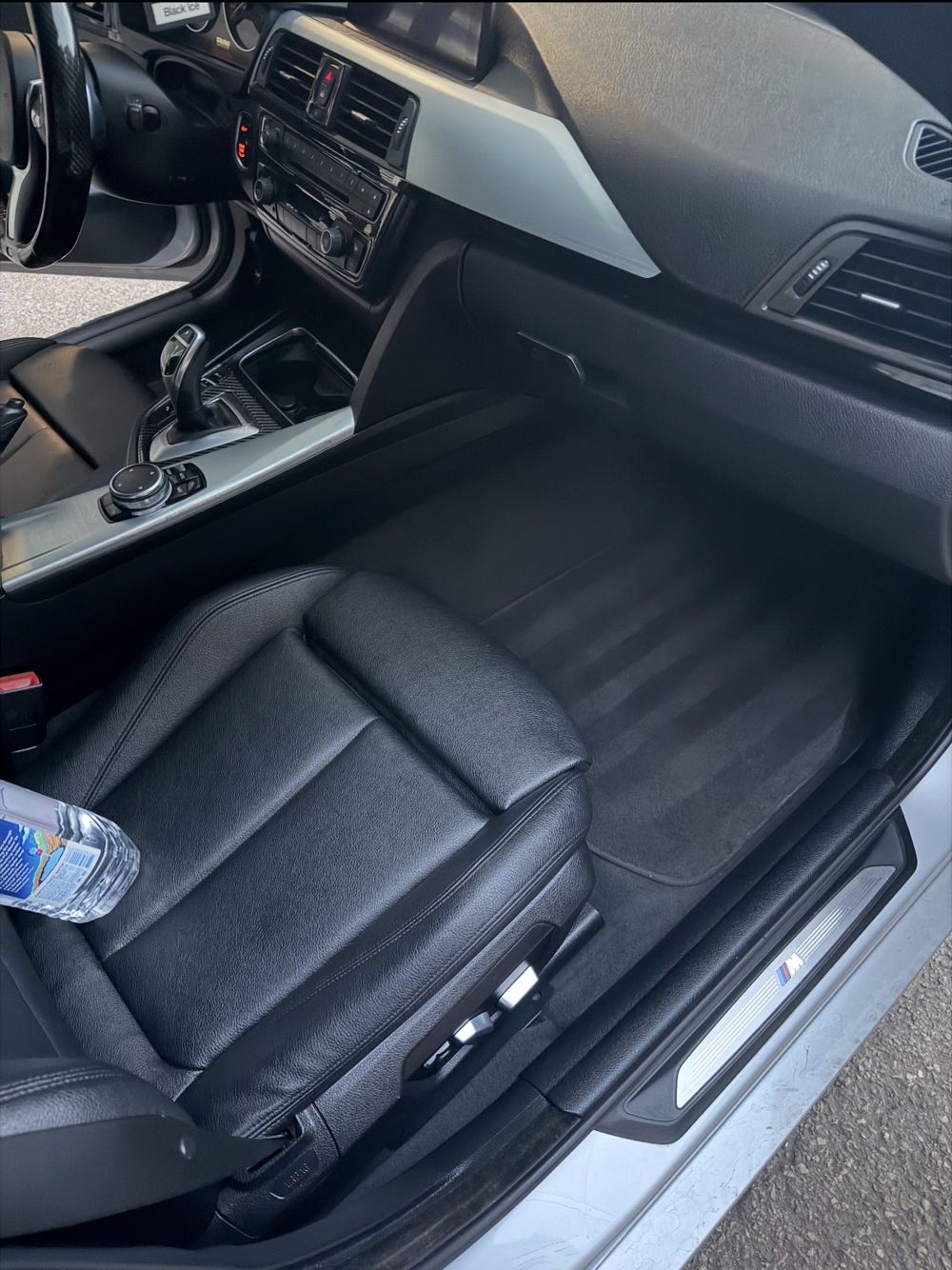 Clean front passenger seat and floor of the same BMW 4 Series
